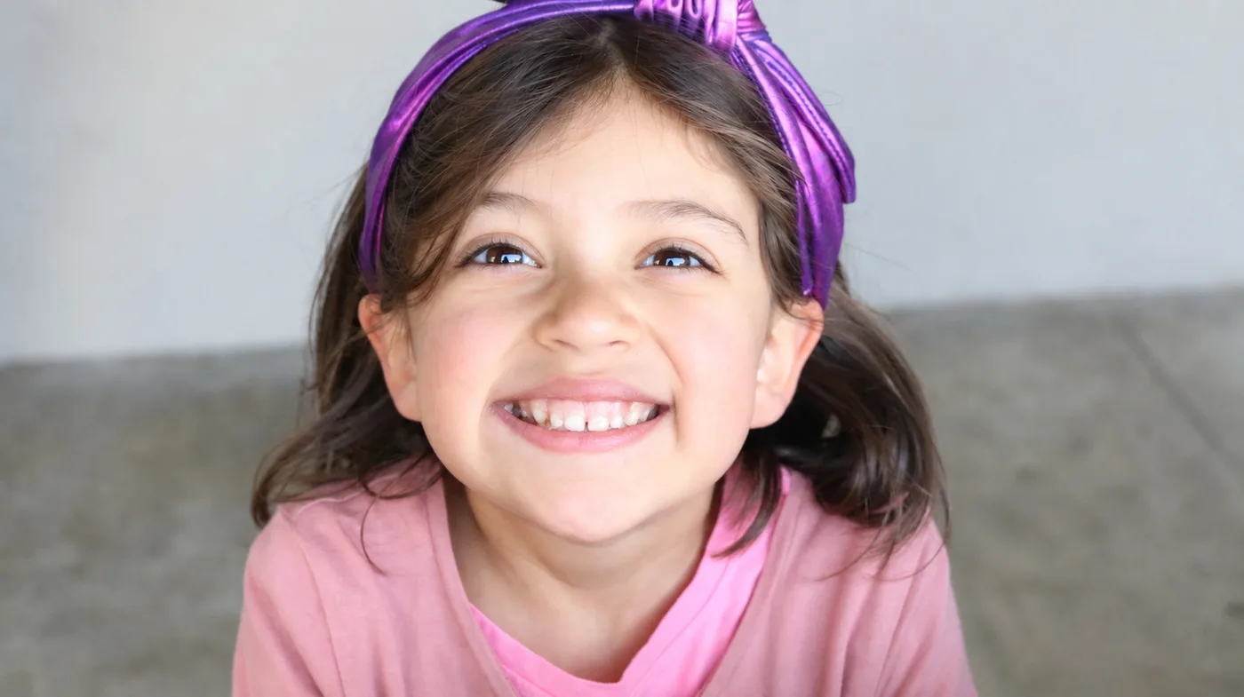 A smiling child from Hope Community Church's Kingdom Academy