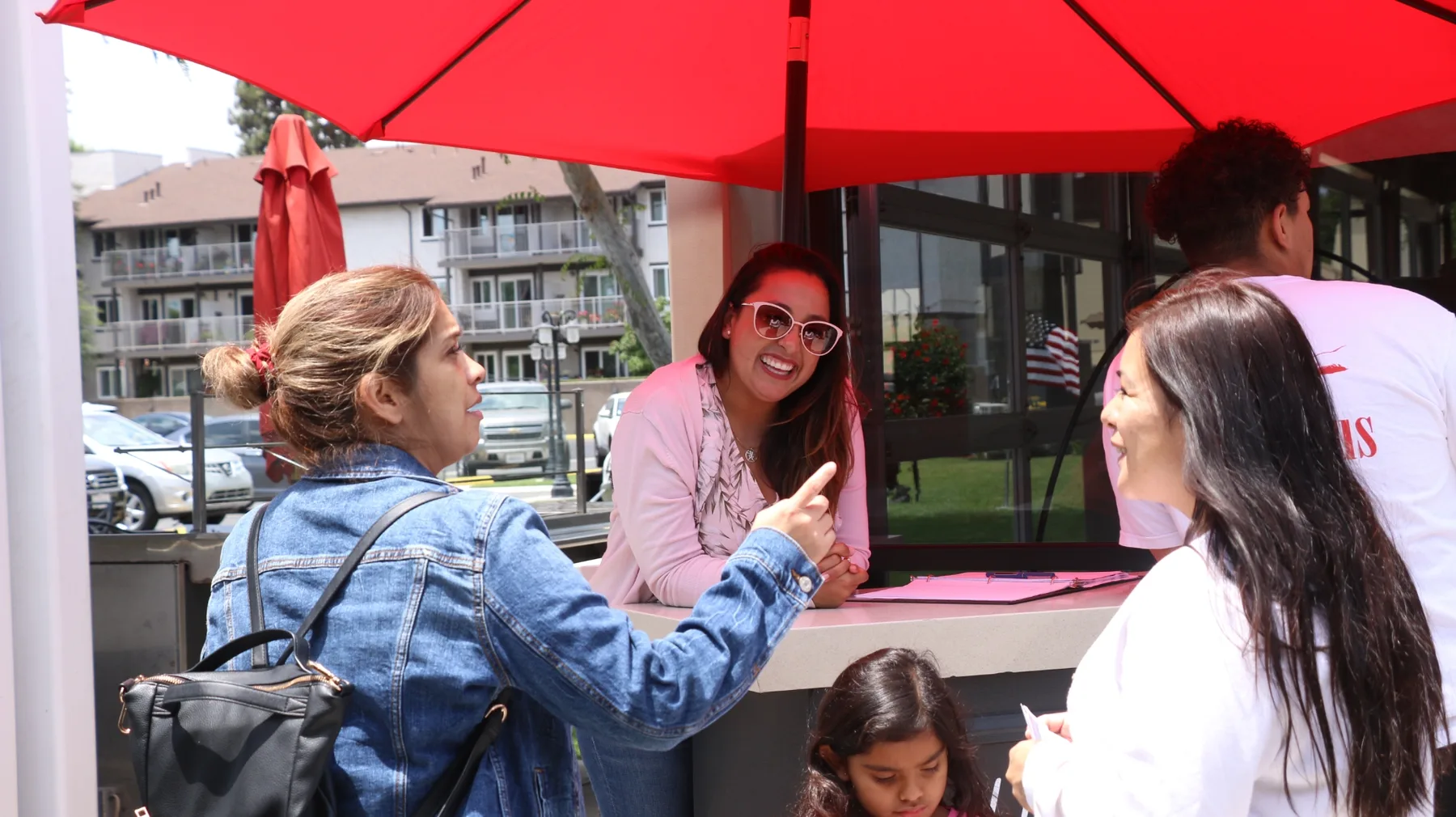 Church members welcoming guests and connecting outside